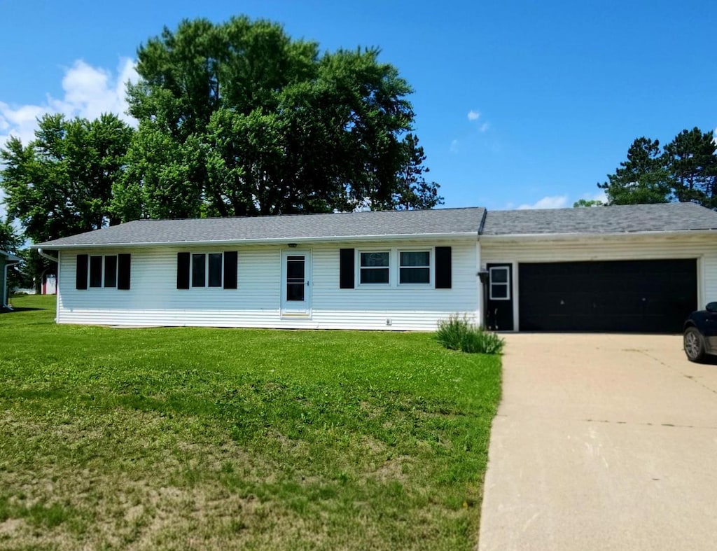 420 W Veterans St, Tomah, WI 54460 - ranch-style house featuring a garage, concrete driveway, and a front yard