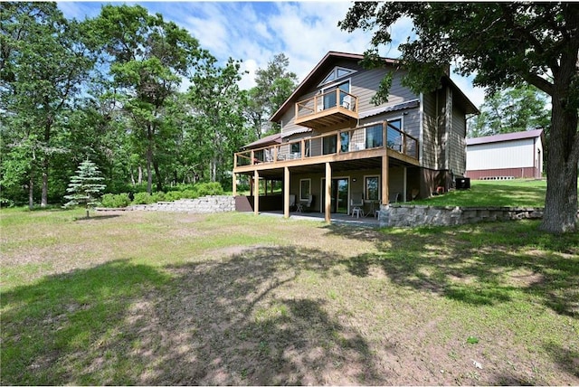 33516 No Mans Trl, Minong, WI 54859 - back of property featuring a lawn and a deck
