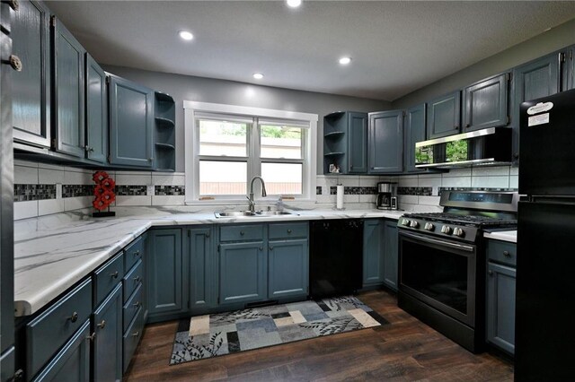 33516 No Mans Trl, Minong, WI 54859 - kitchen with black appliances, open shelves, decorative backsplash, recessed lighting, and dark wood-type flooring