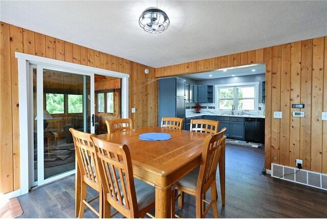 33516 No Mans Trl, Minong, WI 54859 - dining area with wood walls and dark wood-style flooring