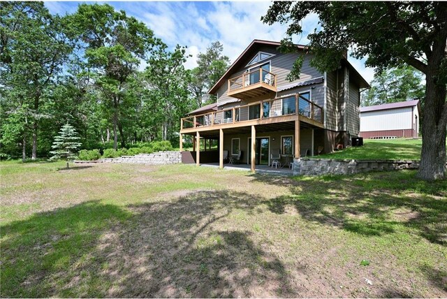 33516 No Mans Trl, Minong, WI 54859 - rear view of property featuring a lawn and a deck