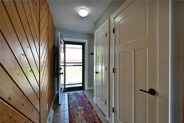 33516 No Mans Trl, Minong, WI 54859 - doorway with light tile patterned floors and baseboards
