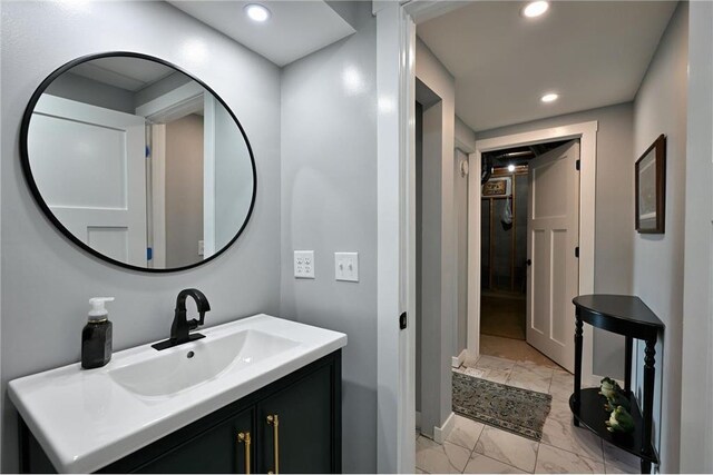 33516 No Mans Trl, Minong, WI 54859 - bathroom featuring marble finish floors, vanity, and recessed lighting