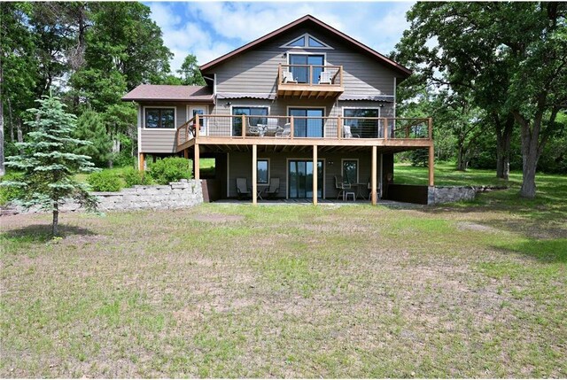 33516 No Mans Trl, Minong, WI 54859 - rear view of property with a deck and a lawn