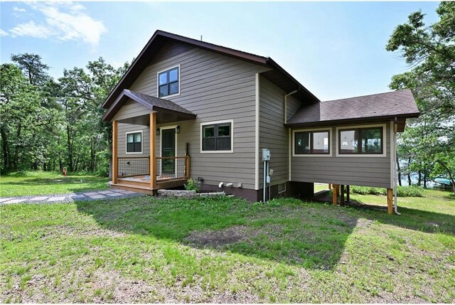 33516 No Mans Trl, Minong, WI 54859 - back of house featuring a yard