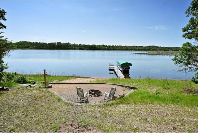 33516 No Mans Trl, Minong, WI 54859 - dock featuring an outdoor fire pit and a water view