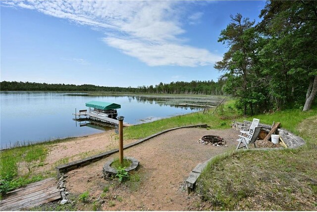 33516 No Mans Trl, Minong, WI 54859 - dock area featuring a water view and a fire pit