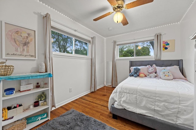 8088 N 65th St, Brown Deer, WI 53223 - bedroom featuring wood finished floors and a ceiling fan