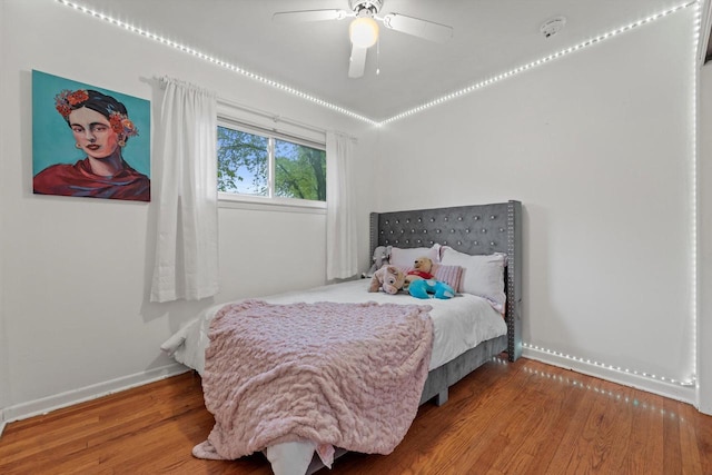 8088 N 65th St, Brown Deer, WI 53223 - bedroom featuring wood finished floors and a ceiling fan