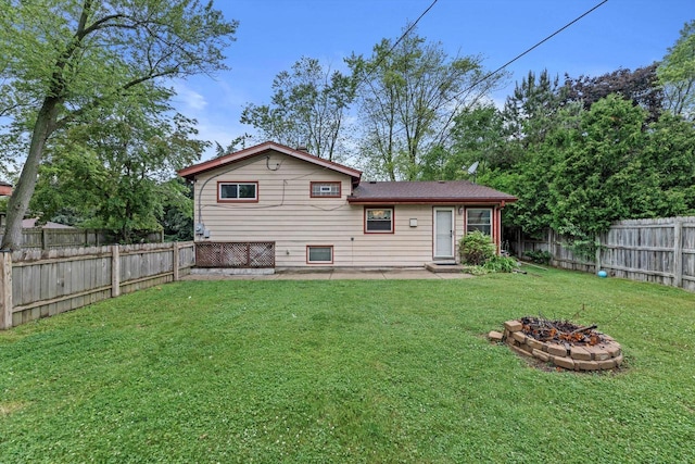 8088 N 65th St, Brown Deer, WI 53223 - rear view of house with a fenced backyard, a fire pit, and a patio