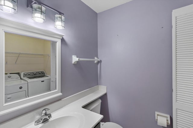 2975 River Birch Dr Unit F, Brookfield, WI 53045 - bathroom with washer and clothes dryer, a closet, and vanity