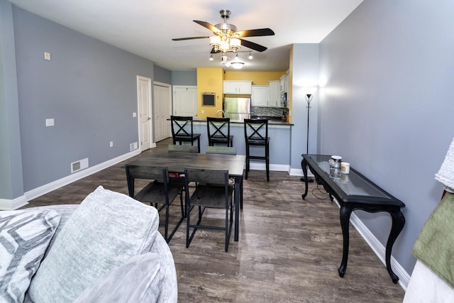 N165W20576 Berry Patch Rd Unit 702, Jackson, WI 53037 - dining space featuring ceiling fan and dark wood-style floors