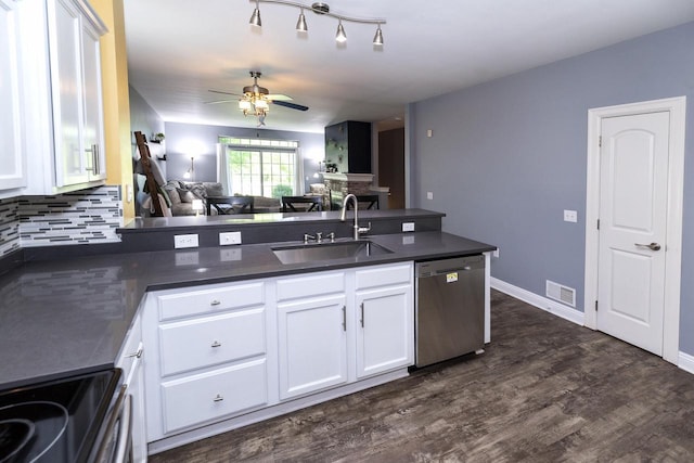 N165W20576 Berry Patch Rd Unit 702, Jackson, WI 53037 - kitchen with appliances with stainless steel finishes, dark countertops, open floor plan, a peninsula, and tasteful backsplash