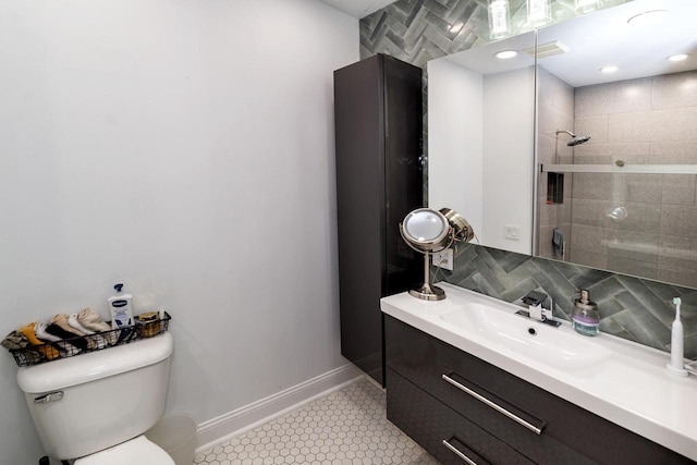 N165W20576 Berry Patch Rd Unit 702, Jackson, WI 53037 - bathroom featuring vanity, tile patterned floors, tiled shower, and backsplash