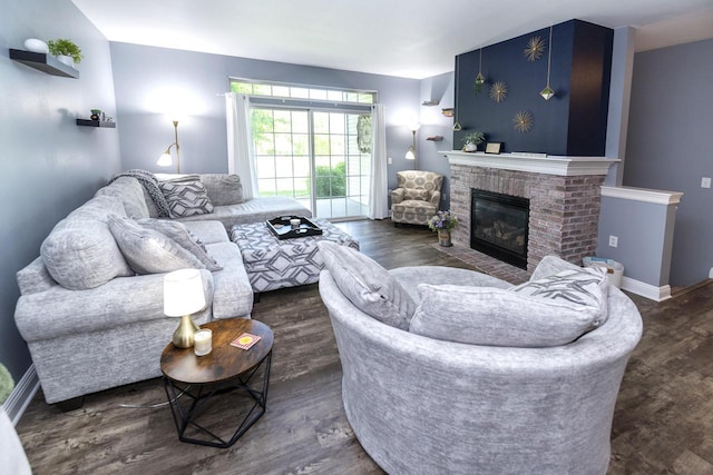 N165W20576 Berry Patch Rd Unit 702, Jackson, WI 53037 - living area featuring dark wood-style flooring and a fireplace