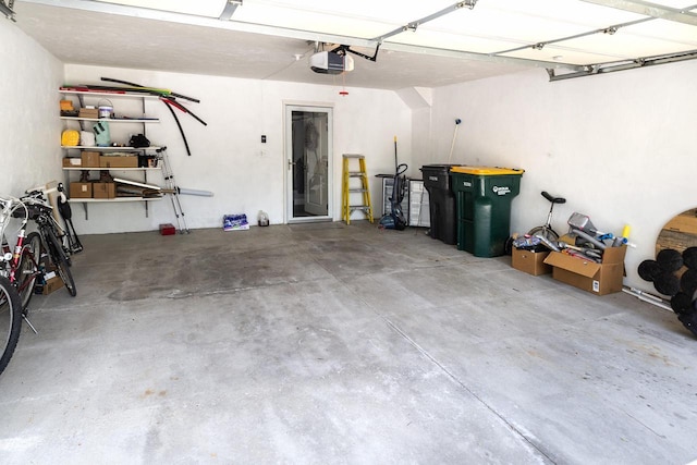 N165W20576 Berry Patch Rd Unit 702, Jackson, WI 53037 - garage featuring a garage door opener