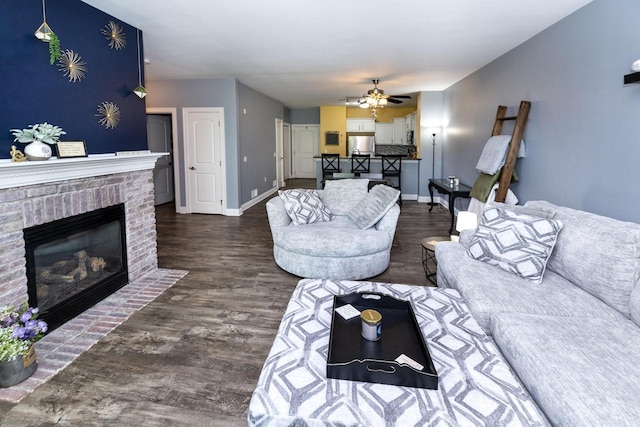 N165W20576 Berry Patch Rd Unit 702, Jackson, WI 53037 - living room featuring wood finished floors, a ceiling fan, and a fireplace