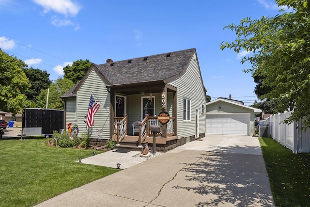 902 E Fremont St, Appleton, WI 54915 - view of front of property featuring covered porch, an outbuilding, a garage, and roof with shingles