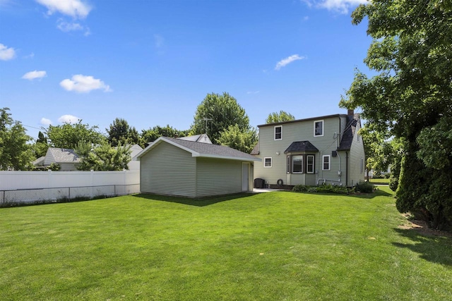 902 E Fremont St, Appleton, WI 54915 - rear view of house with an outbuilding and a chimney