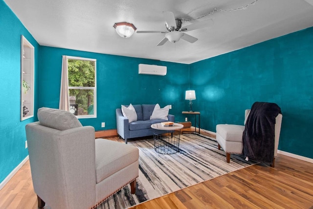 1251 Valley Ln, Green Bay, WI 54303 - living room with a wall mounted air conditioner, wood finished floors, ceiling fan, and a baseboard radiator