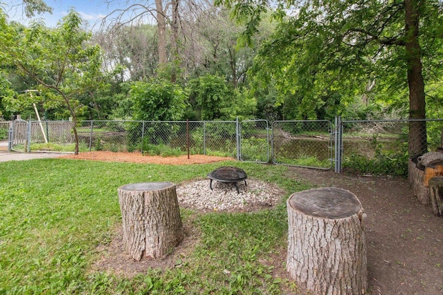 1251 Valley Ln, Green Bay, WI 54303 - view of yard featuring a gate and a fire pit