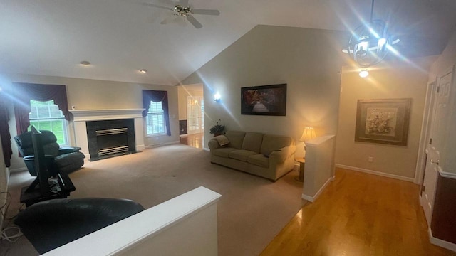 22 Weatherstone Dr, Appleton, WI 54914 - living room with lofted ceiling, a fireplace with flush hearth, ceiling fan, and light wood-style floors