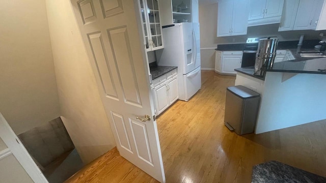 22 Weatherstone Dr, Appleton, WI 54914 - kitchen with white refrigerator with ice dispenser, light wood-type flooring, and dark countertops
