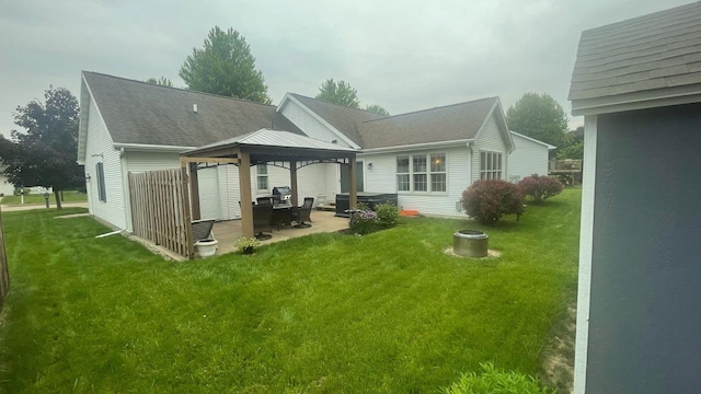 22 Weatherstone Dr, Appleton, WI 54914 - rear view of property with a gazebo, a patio, a lawn, and roof with shingles