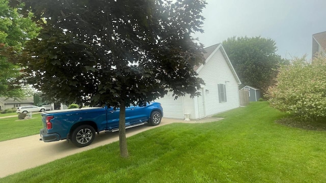 22 Weatherstone Dr, Appleton, WI 54914 - view of side of property with a lawn and a garage