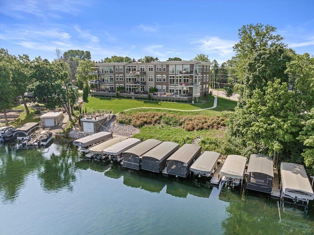 N52W35002 Lake Dr Unit 302, Okauchee, WI 53069 - dock with a water view, a yard, and boat lift