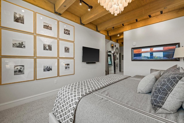 N52W35002 Lake Dr Unit 302, Okauchee, WI 53069 - carpeted bedroom with track lighting, a wooden ceiling with exposed beams, and a chandelier