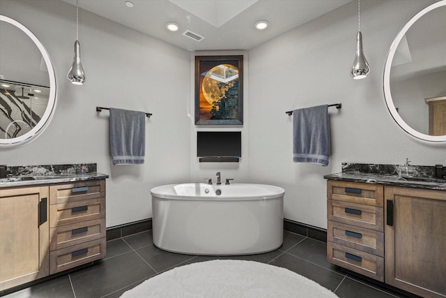 N52W35002 Lake Dr Unit 302, Okauchee, WI 53069 - full bath featuring a soaking tub, two vanities, tile patterned floors, and recessed lighting