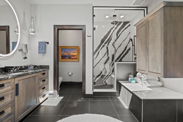 N52W35002 Lake Dr Unit 302, Okauchee, WI 53069 - bathroom with vanity, a shower stall, and tile patterned flooring