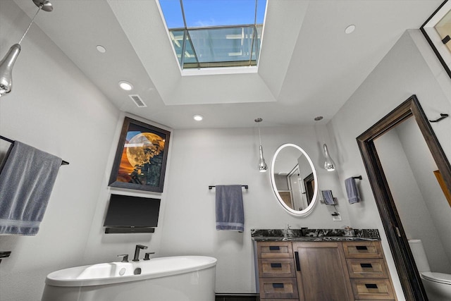 N52W35002 Lake Dr Unit 302, Okauchee, WI 53069 - bathroom featuring a soaking tub, recessed lighting, vanity, and a skylight
