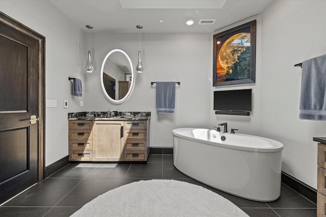 N52W35002 Lake Dr Unit 302, Okauchee, WI 53069 - bathroom with vanity, a freestanding tub, tile patterned flooring, and recessed lighting