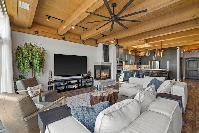 N52W35002 Lake Dr Unit 302, Okauchee, WI 53069 - living room with a wooden ceiling with exposed beams, dark wood-style floors, ceiling fan, a chandelier, and a fireplace