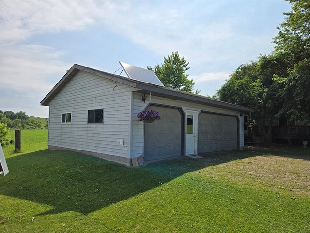N35182 Weverstad Rd, Blair, WI 54616 - view of side of home with a detached garage and a yard