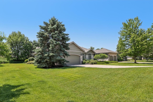 16885 Lake Rd Unit A, Brookfield, WI 53005 - view of front of house featuring driveway, a front lawn, and an attached garage