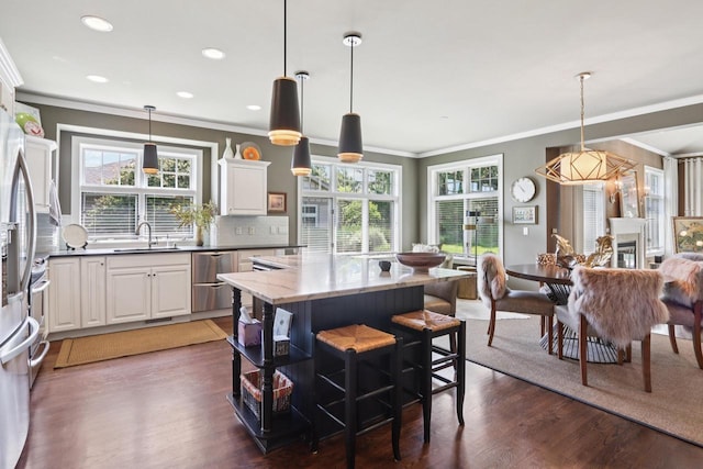 16885 Lake Rd Unit A, Brookfield, WI 53005 - kitchen with dishwasher, a center island, wood finished floors, plenty of natural light, and crown molding