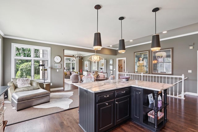 16885 Lake Rd Unit A, Brookfield, WI 53005 - kitchen featuring crown molding, dark wood-style flooring, light stone countertops, open floor plan, and a kitchen island