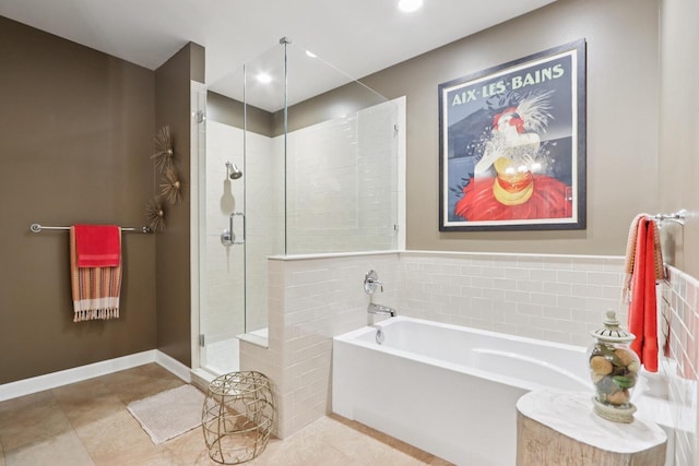 16885 Lake Rd Unit A, Brookfield, WI 53005 - full bathroom featuring a bath, a stall shower, tile walls, recessed lighting, and tile patterned flooring