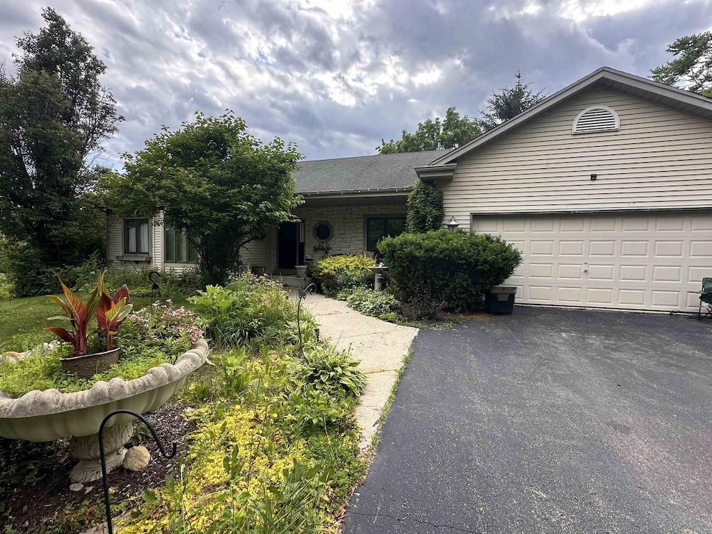 N3131 Center St, Lake Geneva, WI 53147 - ranch-style home featuring driveway and an attached garage