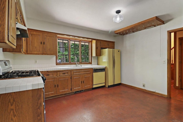 3023 Bruce Dr, Racine, WI 53404 - kitchen featuring tile countertops, white appliances, range hood, and brown cabinets