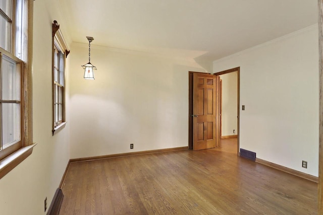 3023 Bruce Dr, Racine, WI 53404 - spare room with wood finished floors and crown molding