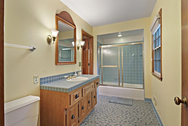 3023 Bruce Dr, Racine, WI 53404 - bathroom with vanity, enclosed tub / shower combo, and tile patterned floors