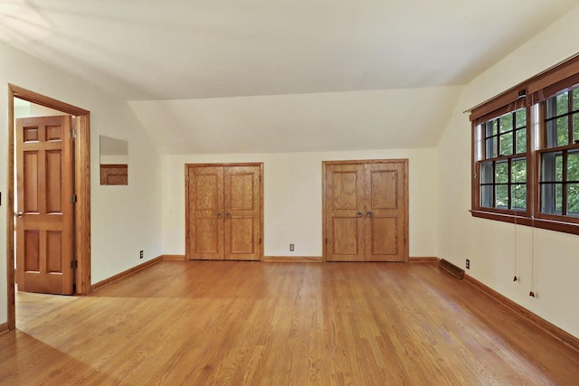 3023 Bruce Dr, Racine, WI 53404 - additional living space with lofted ceiling and light wood-style floors