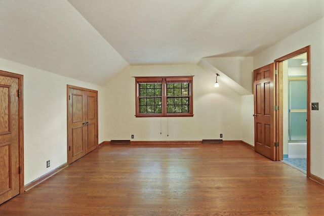 3023 Bruce Dr, Racine, WI 53404 - bonus room featuring wood finished floors and vaulted ceiling