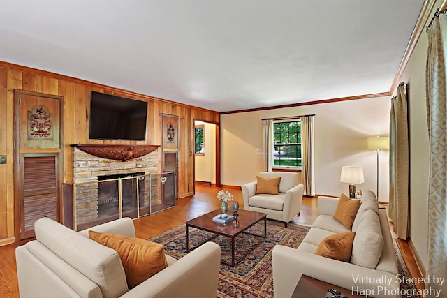 3023 Bruce Dr, Racine, WI 53404 - living area featuring ornamental molding, wooden walls, wood finished floors, and a fireplace