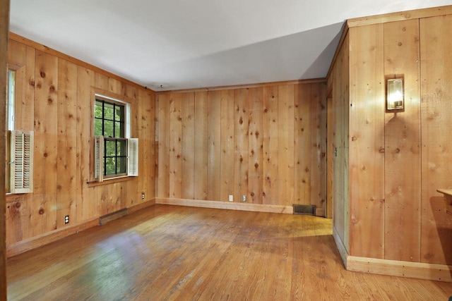 3023 Bruce Dr, Racine, WI 53404 - empty room with wood finished floors and wooden walls