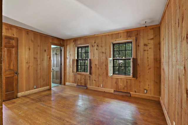 3023 Bruce Dr, Racine, WI 53404 - unfurnished room featuring wood finished floors and wood walls